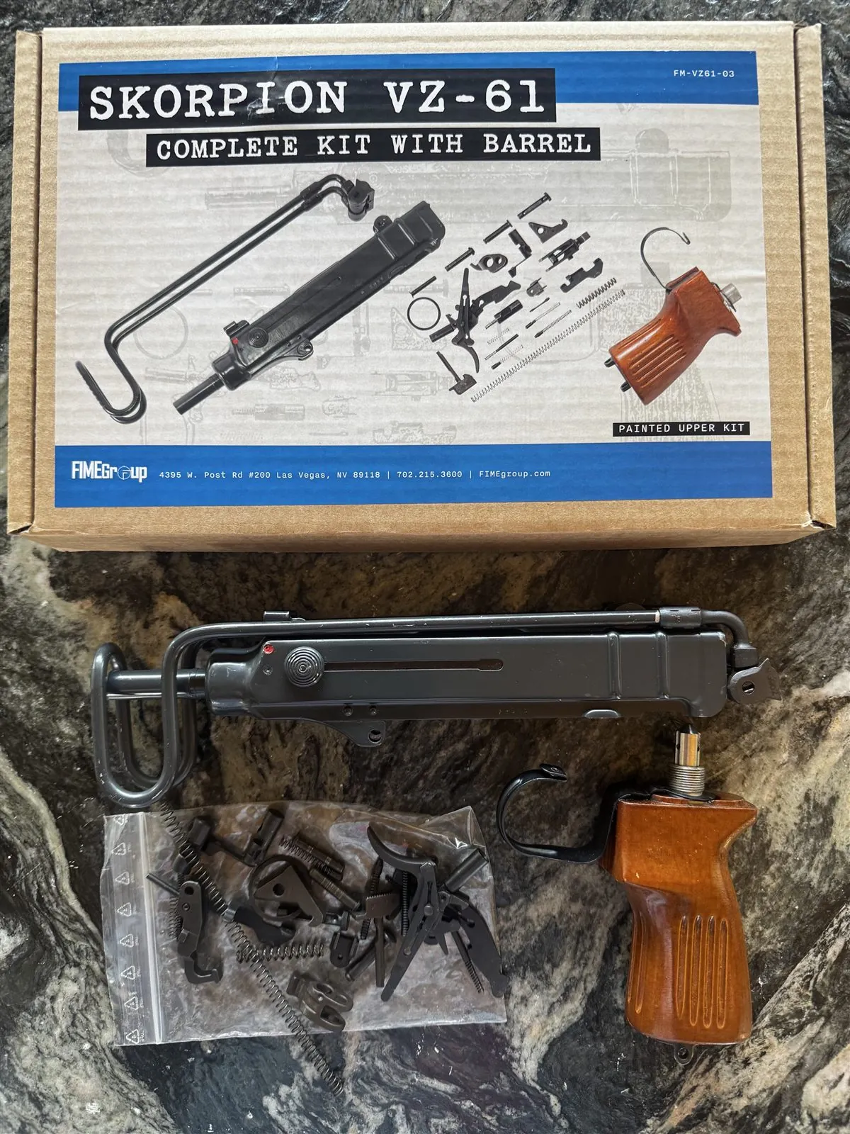 VZ 61 Skorpion parts kit and box arranged on a bench