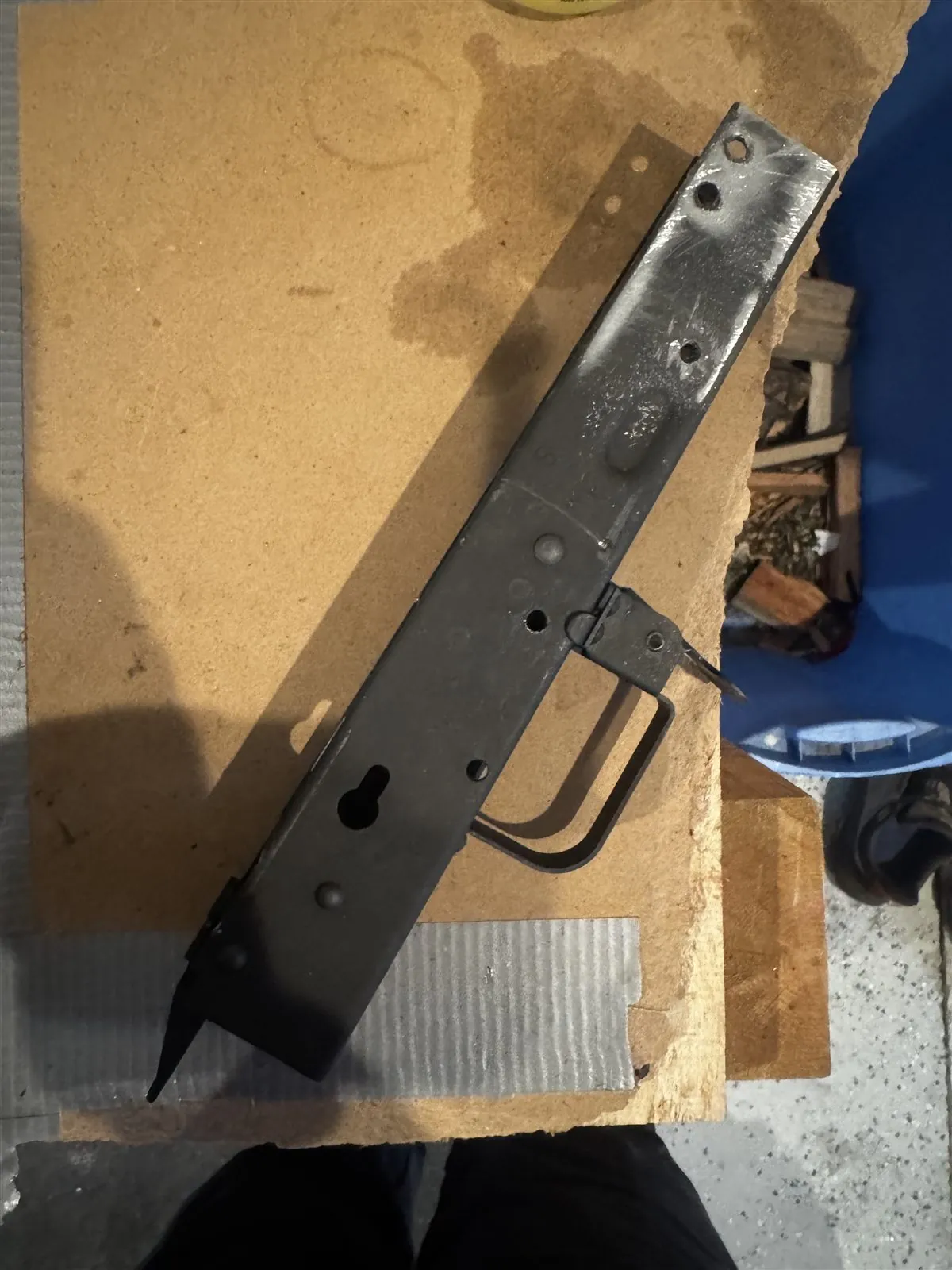 Stripped VSKA receiver on cardboard at Cody's workbench