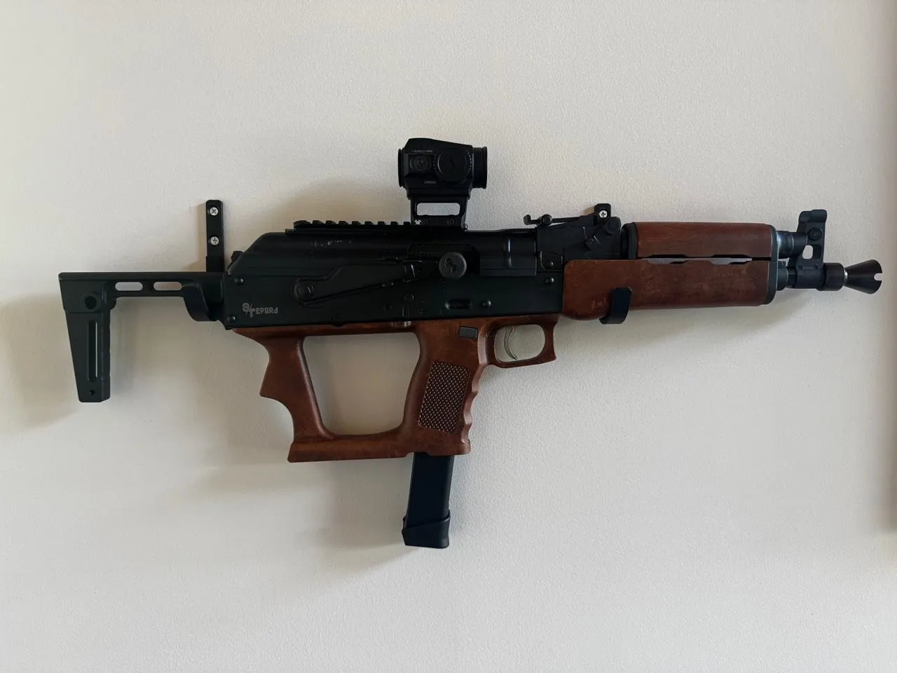 Stuff and Things Gepard 9mm AK-pattern firearm mounted on a wall