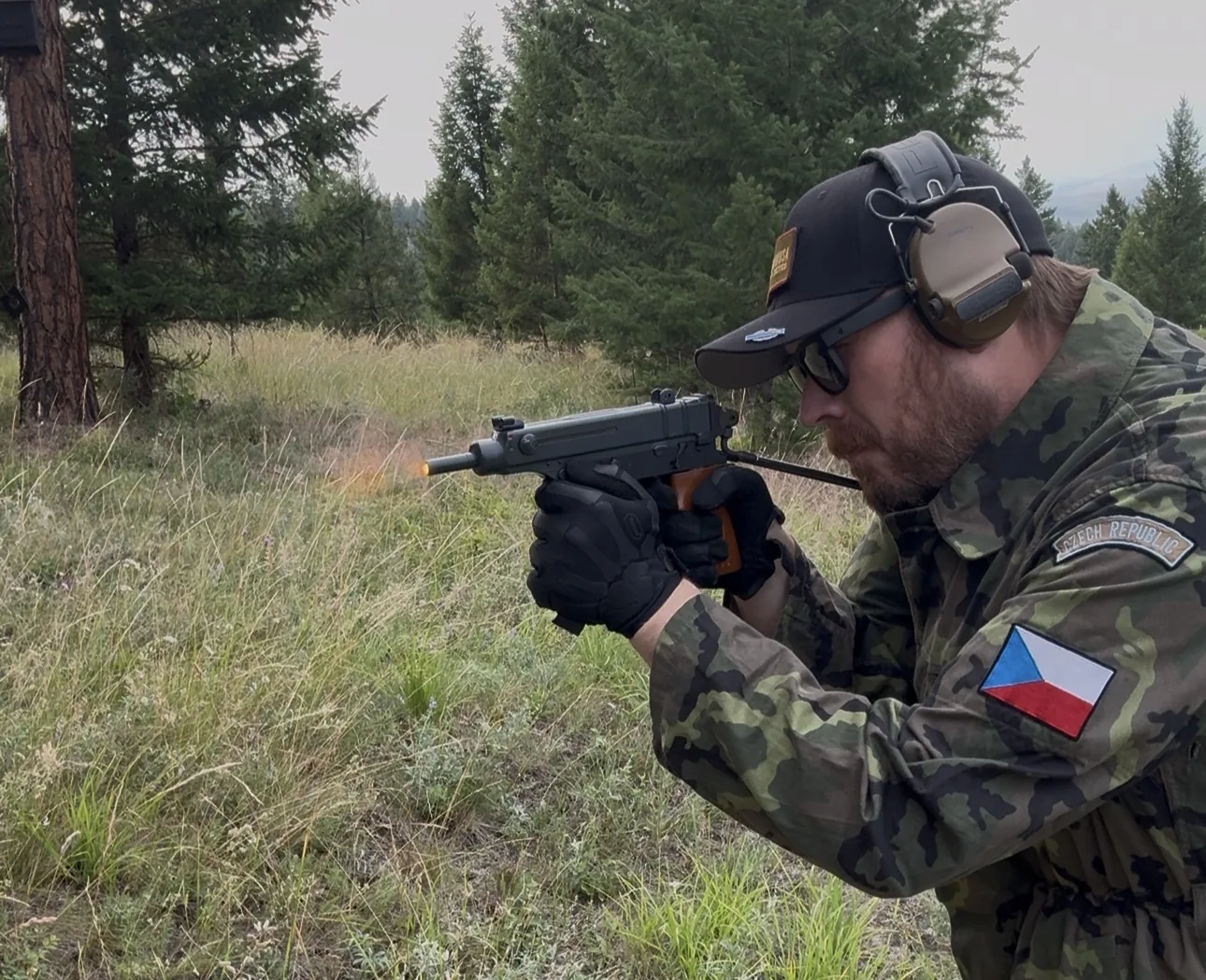 Cody firing the completed VZ 61 Skorpion personal build outdoors