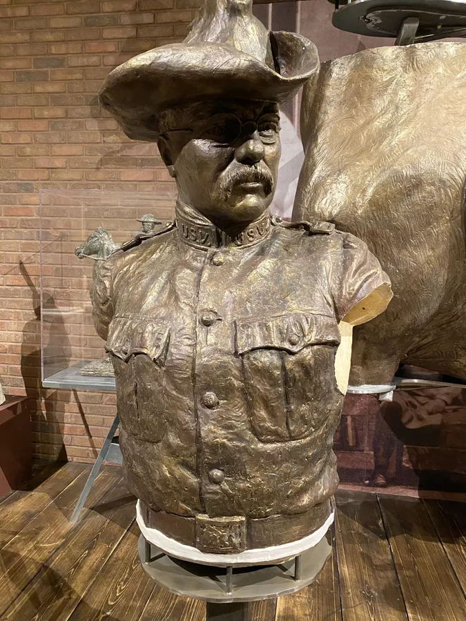 Western cowboy bust in museum lighting
